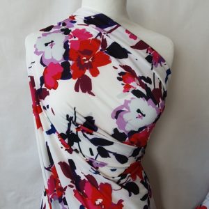 Big Bold Floral of Reds/Purples in a Micro Jersey stretch 'Portia 5599' by John Kaldor